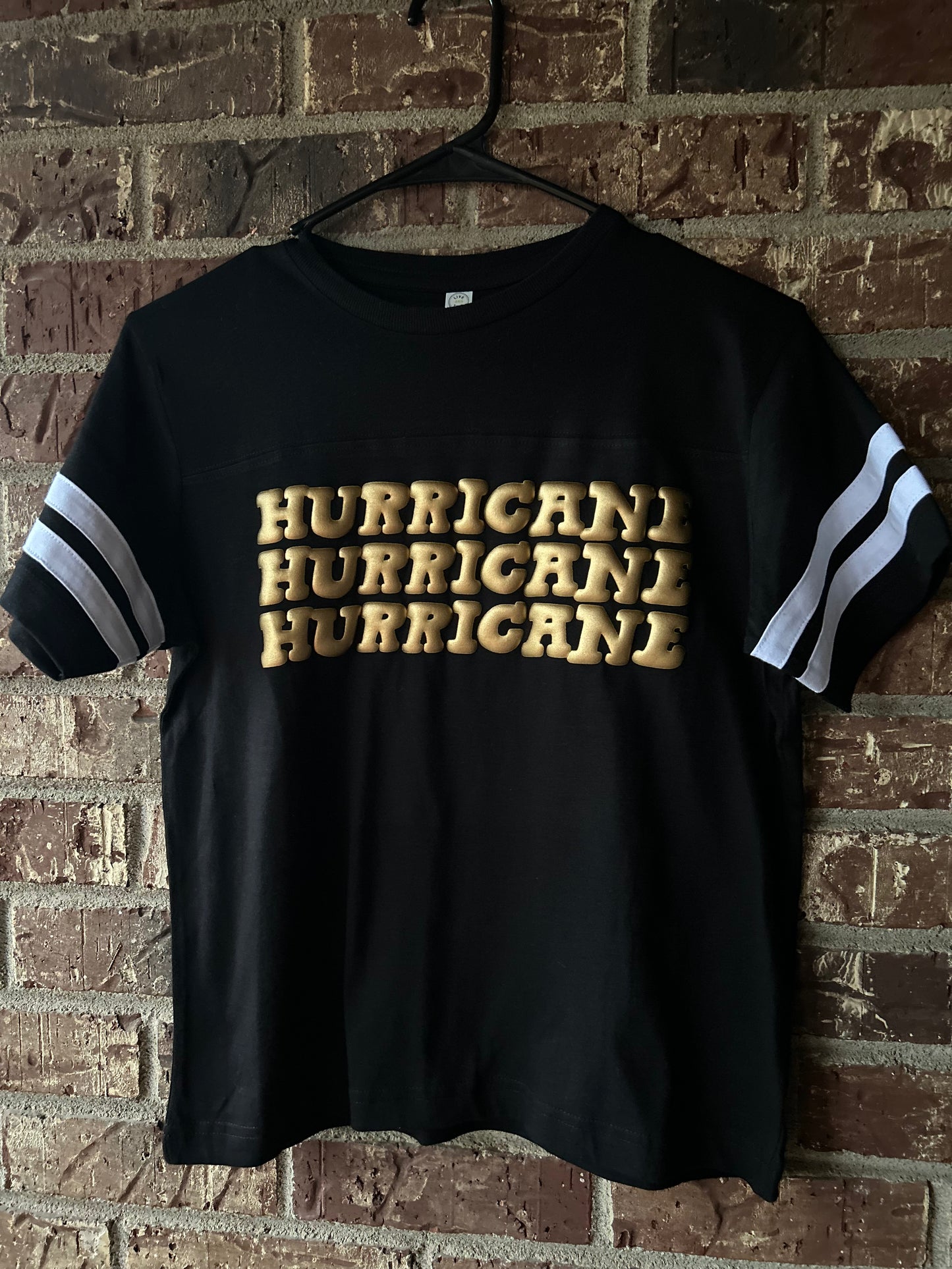 Jonesboro Hurricane Varsity Tee - black/gold puff