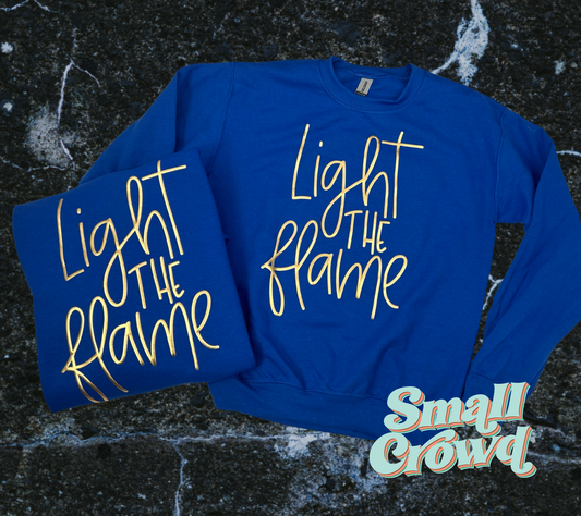 Light The Flame Valley View - metallic gold on royal sweatshirt